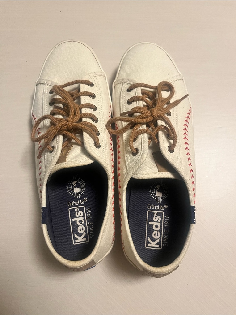 Keds White Canvas Sneakers with Brown Laces and Red Stitching